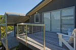 Waiheke The Palms: West facing decks on Waiheke holiday house