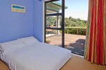 Waiheke Palm Beach Retreat: Study with bed made up